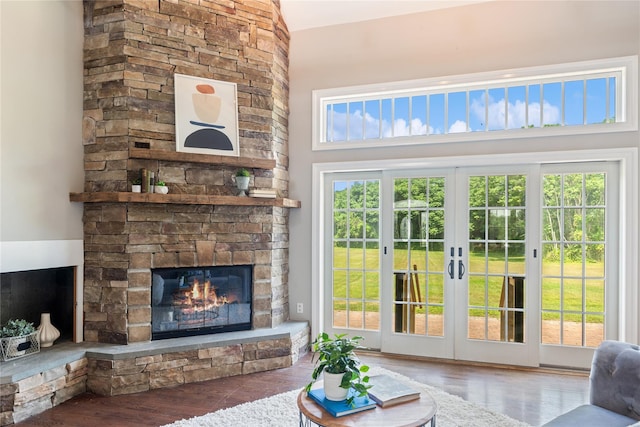 1465 Ackerly Pond Ln, Southold, NY 11971 - living area featuring a fireplace, wood finished floors, and french doors