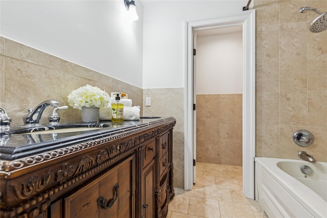 1465 Ackerly Pond Ln, Southold, NY 11971 - full bath featuring tile walls, shower / tub combination, vanity, and stone finish flooring