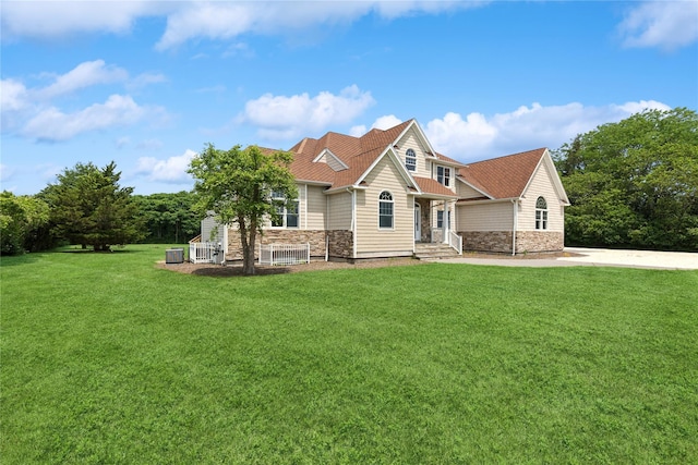 1465 Ackerly Pond Ln, Southold, NY 11971 - view of front of home with a front lawn and stone siding