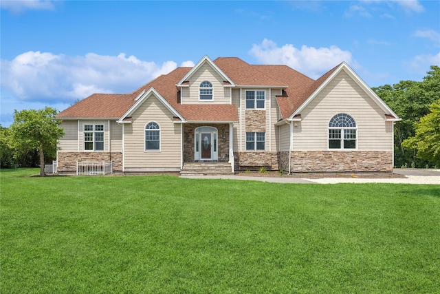 1465 Ackerly Pond Ln, Southold, NY 11971 - view of front facade with stone siding and a front lawn