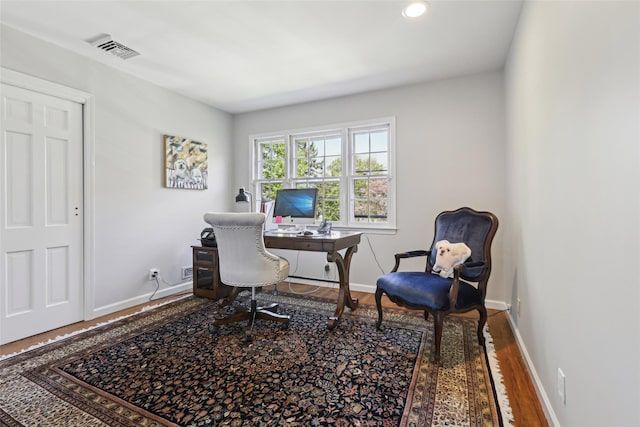 office space with wood finished floors, baseboards, and recessed lighting