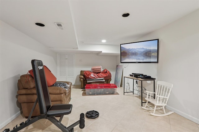 sitting room featuring baseboards, tile patterned flooring, and recessed lighting