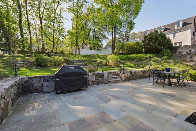 view of patio / terrace with a grill and outdoor dining area