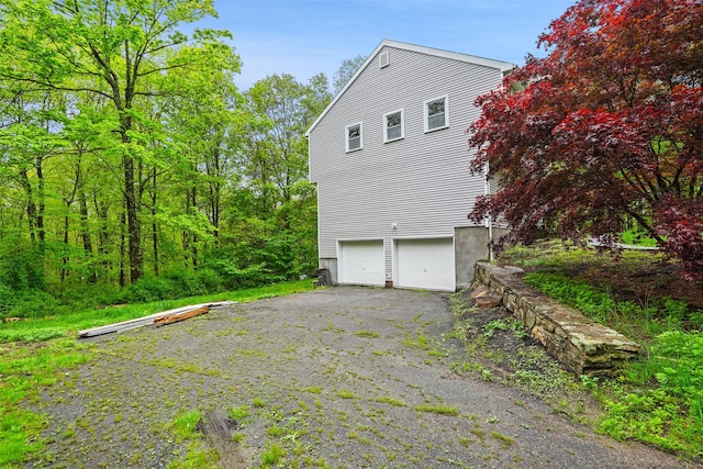 98 Smith Ridge Rd, South Salem, NY 10590 - view of side of home with an attached garage and driveway