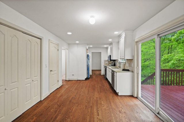 98 Smith Ridge Rd, South Salem, NY 10590 - kitchen featuring white cabinets, light countertops, wood finished floors, recessed lighting, and decorative backsplash