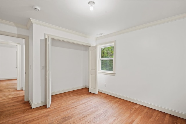 98 Smith Ridge Rd, South Salem, NY 10590 - unfurnished bedroom with ornamental molding, light wood-style floors, baseboards, and a closet