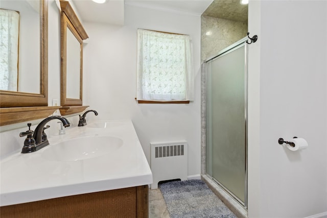 720 Midwood Rd, Cutchogue, NY 11935 - full bath featuring radiator, double vanity, a shower stall, and tile patterned floors