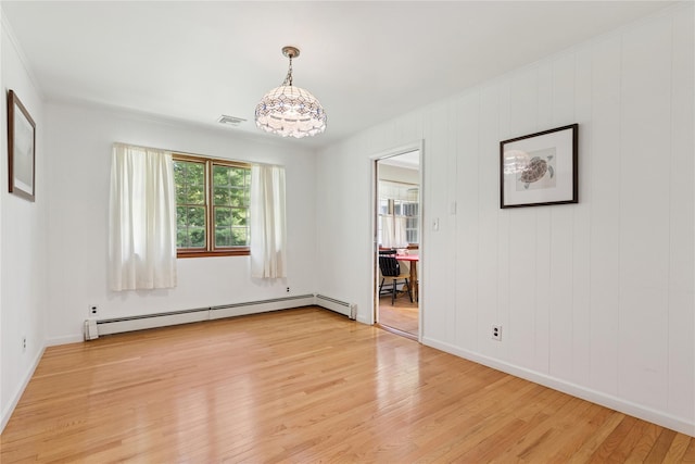 720 Midwood Rd, Cutchogue, NY 11935 - empty room with a baseboard radiator, light wood finished floors, a chandelier, and crown molding