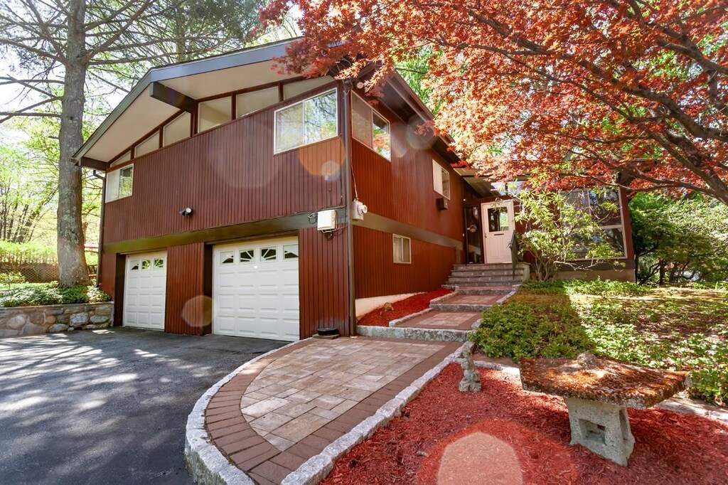 415 Furnace Dock Rd, Cortlandt Manor, NY 10567 - view of property exterior featuring driveway and a garage
