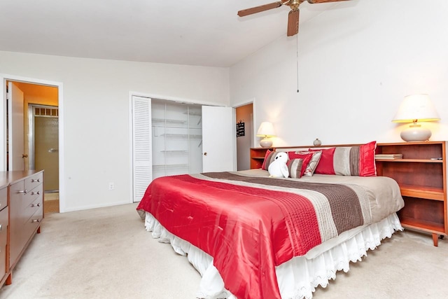 carpeted bedroom with baseboards, ceiling fan, a closet, and lofted ceiling