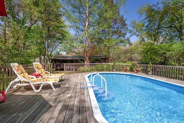 outdoor pool featuring a wooden deck