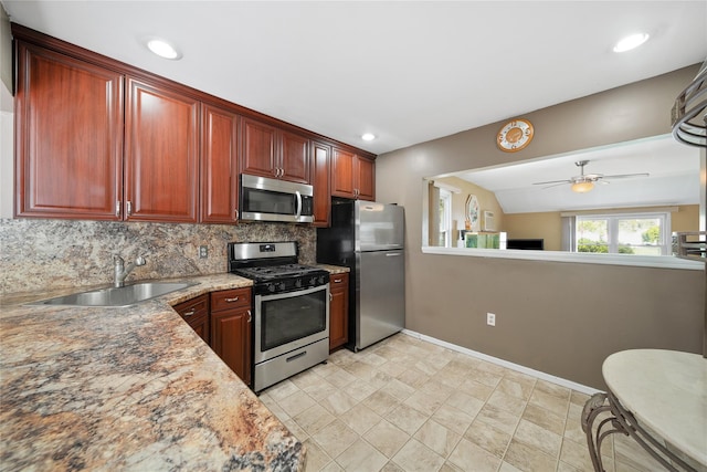 96 Pardee Ave, Islip, NY 11751 - kitchen featuring stainless steel appliances, a sink, backsplash, a ceiling fan, and baseboards