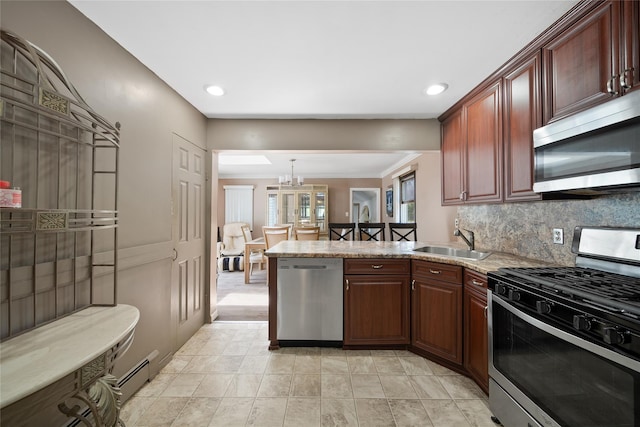 96 Pardee Ave, Islip, NY 11751 - kitchen featuring appliances with stainless steel finishes, a sink, a peninsula, tasteful backsplash, and recessed lighting