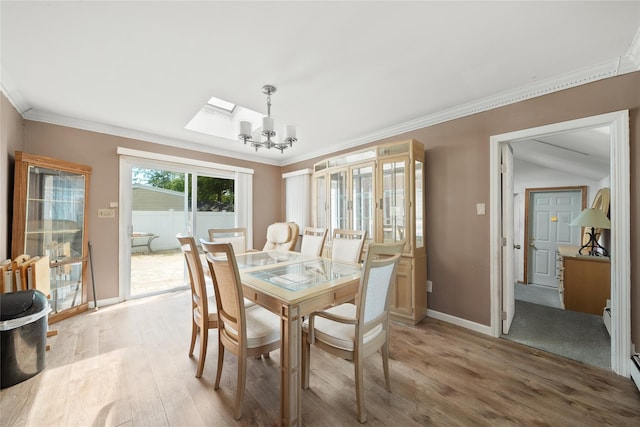 96 Pardee Ave, Islip, NY 11751 - dining room with a chandelier, light wood-type flooring, ornamental molding, and baseboards