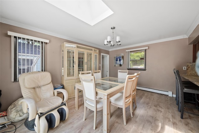 96 Pardee Ave, Islip, NY 11751 - dining space featuring a baseboard radiator, a chandelier, a skylight, ornamental molding, and light wood finished floors