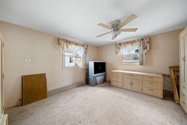 96 Pardee Ave, Islip, NY 11751 - unfurnished office with plenty of natural light, a ceiling fan, light colored carpet, and baseboards