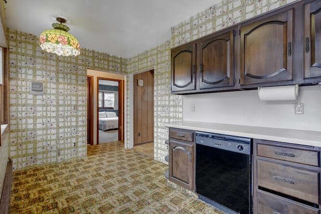 kitchen featuring light countertops, black dishwasher, dark brown cabinets, and wallpapered walls