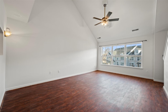 unfurnished room with visible vents, wood finished floors, baseboards, high vaulted ceiling, and a ceiling fan
