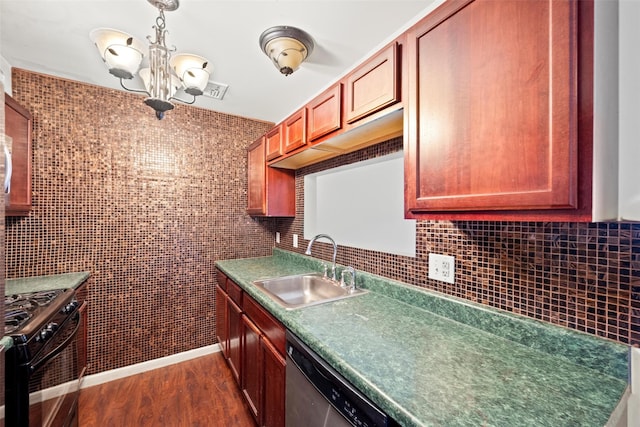kitchen featuring an inviting chandelier, dark wood-type flooring, a sink, dishwasher, and black gas range oven