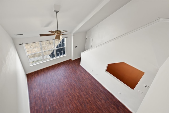 interior space featuring baseboards, ceiling fan, wood finished floors, and visible vents