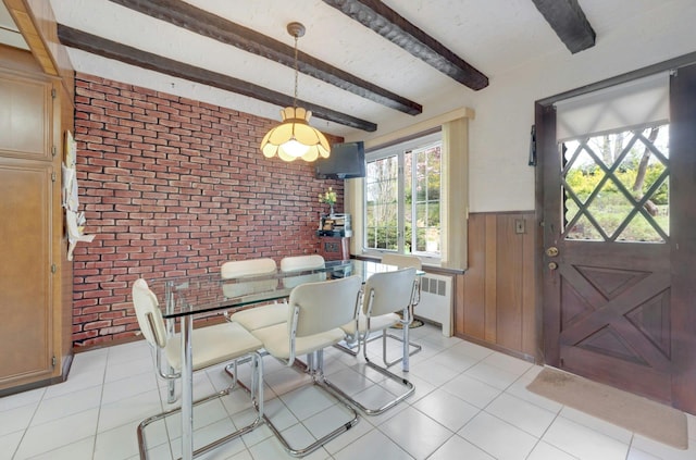 572 Scarsdale Rd, Tuckahoe, NY 10707 - dining space featuring beamed ceiling, brick wall, wainscoting, and radiator