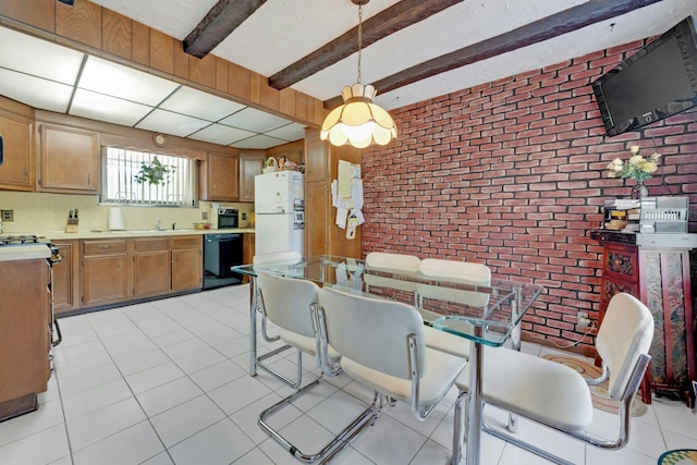 572 Scarsdale Rd, Tuckahoe, NY 10707 - dining space with light tile patterned floors, brick wall, and beamed ceiling