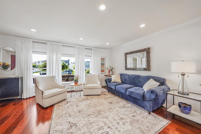86 Jefferson Ave, Island Park, NY 11558 - living room with ornamental molding, a healthy amount of sunlight, and wood finished floors