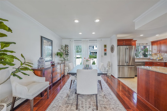 86 Jefferson Ave, Island Park, NY 11558 - dining room featuring recessed lighting, ornamental molding, and wood finished floors