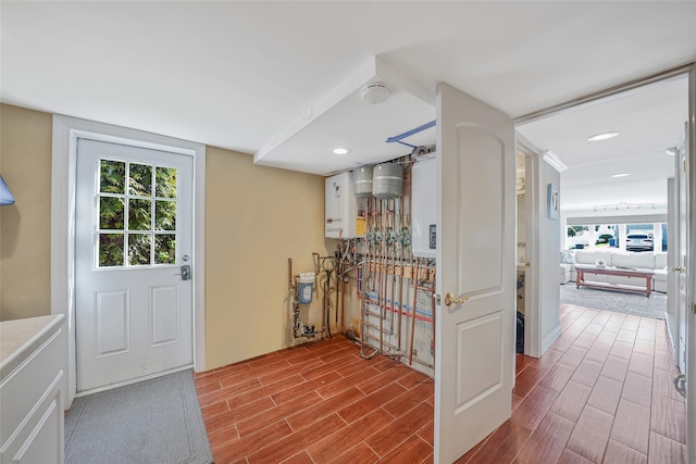 86 Jefferson Ave, Island Park, NY 11558 - entrance foyer with tankless water heater, recessed lighting, and wood finished floors