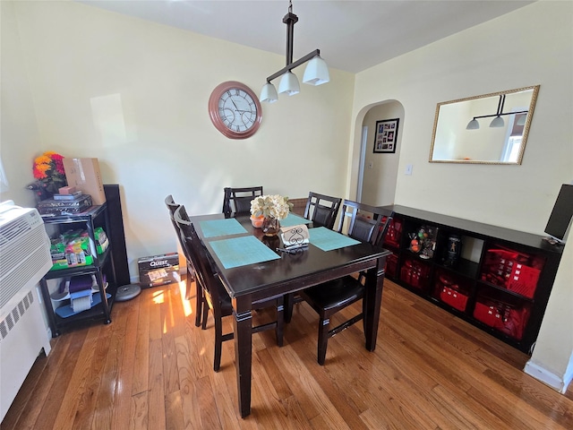 221-15 112th Ave, Queens Village, NY 11429 - dining room with arched walkways and wood-type flooring