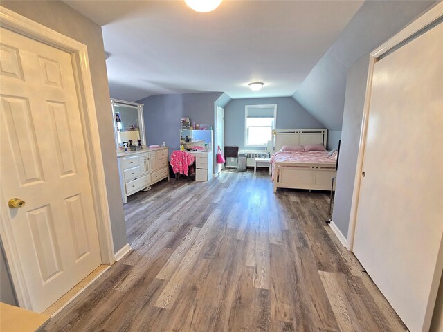 221-15 112th Ave, Queens Village, NY 11429 - bedroom featuring dark wood-style flooring, vaulted ceiling, and baseboards