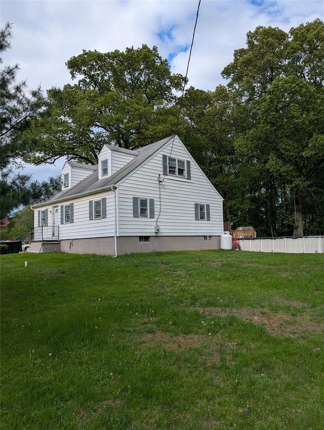 view of home's exterior featuring a yard
