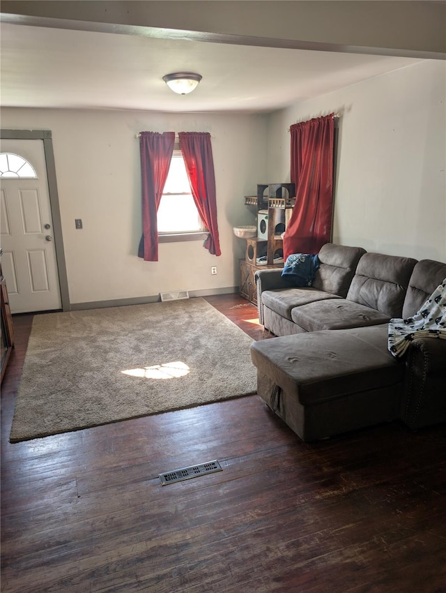 living area featuring wood finished floors and baseboards