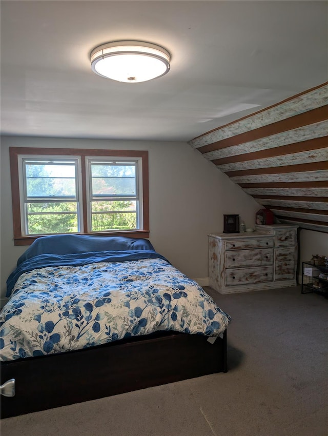 bedroom featuring vaulted ceiling and carpet