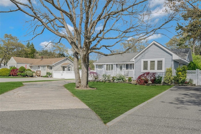 203 N Coleman Rd, Centereach, NY 11720 - single story home featuring driveway, roof with shingles, and a porch
