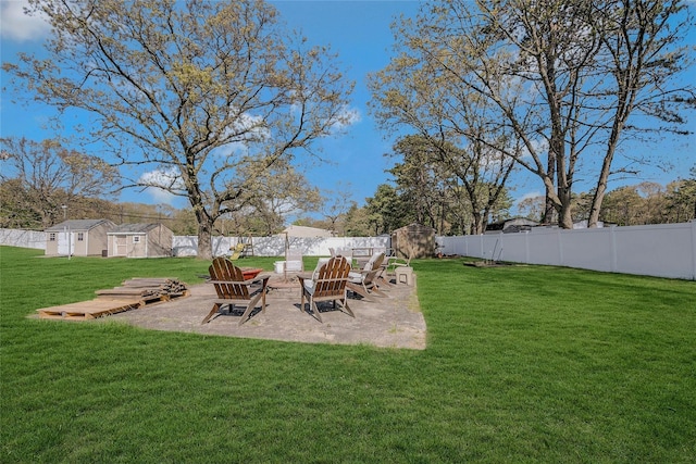 203 N Coleman Rd, Centereach, NY 11720 - view of yard with an outdoor structure, a storage unit, and a patio area