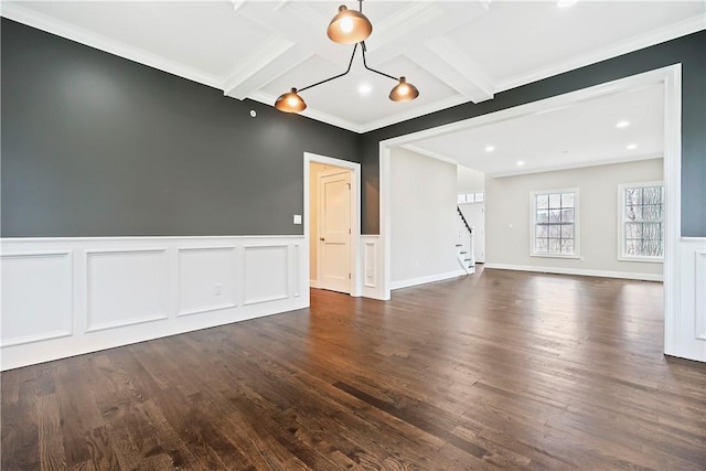 interior space featuring crown molding, beam ceiling, dark wood-style floors, stairway, and coffered ceiling