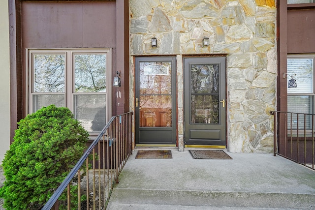 entrance to property with stone siding