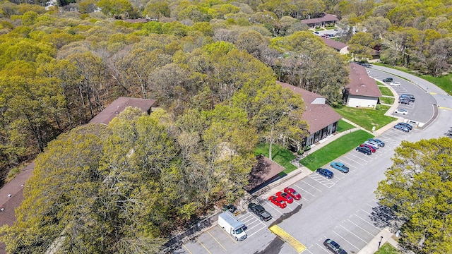 birds eye view of property with a wooded view