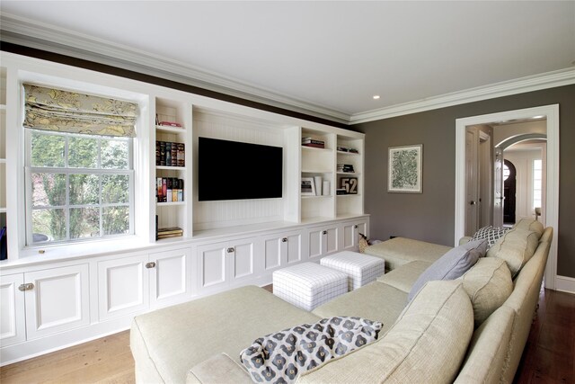 52 Northwoods Rd, Manhasset, NY 11030 - living area with crown molding, arched walkways, light wood-type flooring, and plenty of natural light