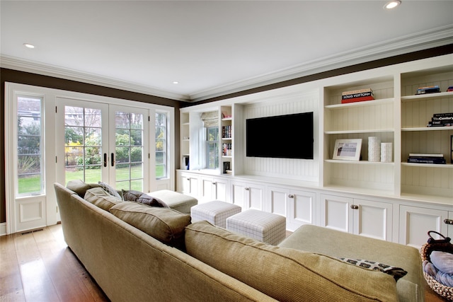 52 Northwoods Rd, Manhasset, NY 11030 - living area featuring french doors, crown molding, light wood-style floors, recessed lighting, and built in shelves