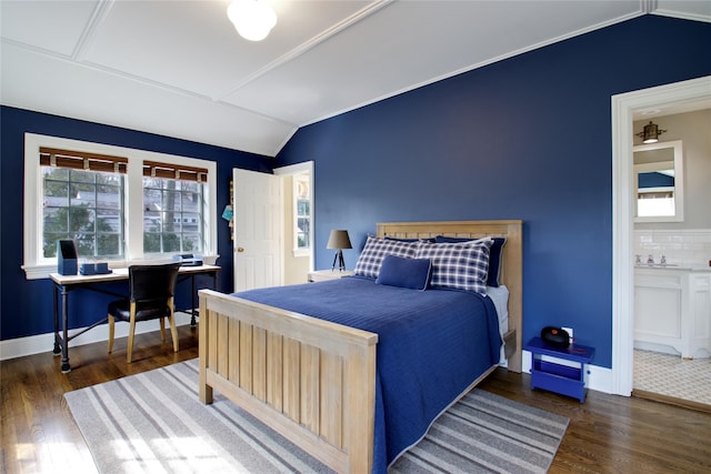 52 Northwoods Rd, Manhasset, NY 11030 - bedroom with lofted ceiling, wood finished floors, baseboards, a desk, and ensuite bathroom