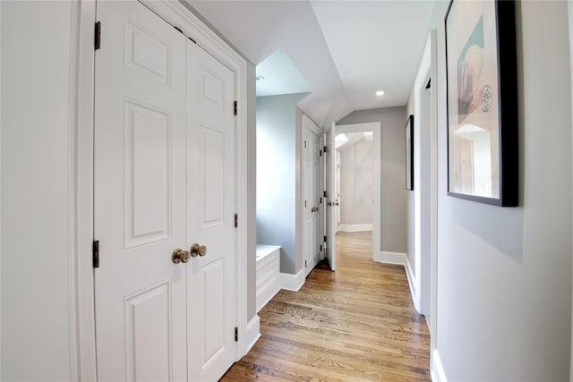 52 Northwoods Rd, Manhasset, NY 11030 - hall with light wood-style floors, baseboards, and recessed lighting
