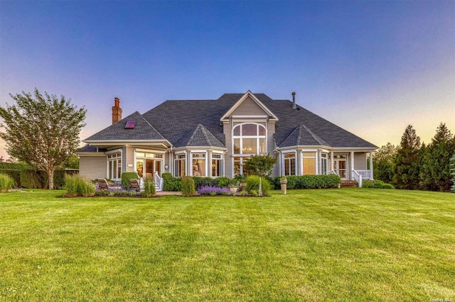 1640 Grandview Dr, Orient, NY 11957 - view of front facade featuring a chimney and a lawn