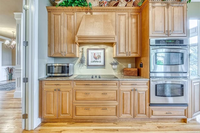 1640 Grandview Dr, Orient, NY 11957 - kitchen featuring stainless steel appliances, custom exhaust hood, light wood finished floors, crown molding, and light stone countertops