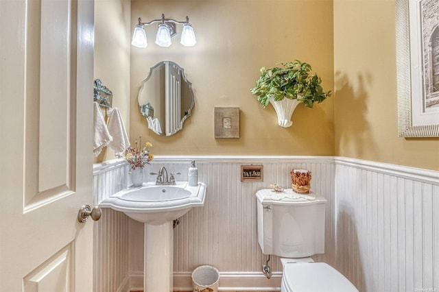 1640 Grandview Dr, Orient, NY 11957 - half bathroom with toilet and a wainscoted wall