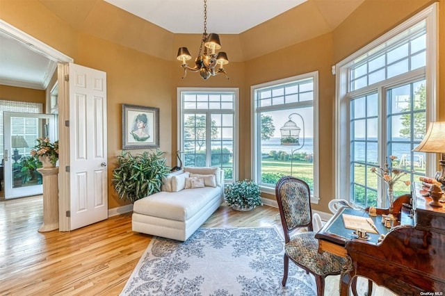 1640 Grandview Dr, Orient, NY 11957 - living area with a chandelier, light wood-style flooring, healthy amount of natural light, and a towering ceiling
