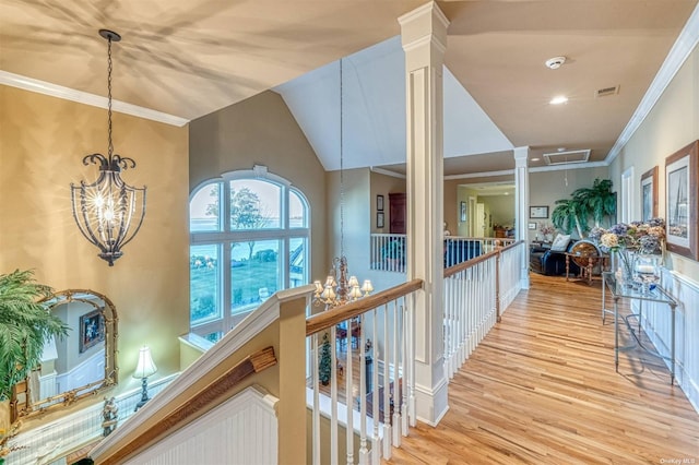 1640 Grandview Dr, Orient, NY 11957 - corridor with a chandelier, light wood-style flooring, an upstairs landing, and ornamental molding