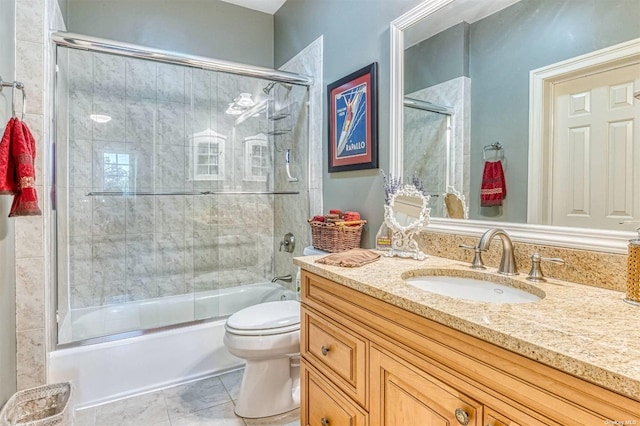 1640 Grandview Dr, Orient, NY 11957 - full bathroom with vanity, toilet, shower / bath combination with glass door, and tile patterned floors