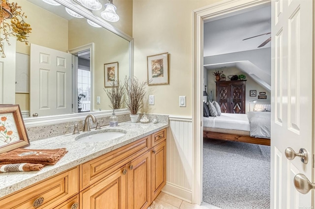 1640 Grandview Dr, Orient, NY 11957 - ensuite bathroom featuring vanity, a wainscoted wall, tile patterned flooring, and ceiling fan
